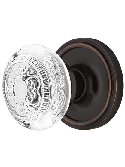Classic Rosette Door Set with Egg and Dart Crystal-Glass Knobs in Timeless Bronze.